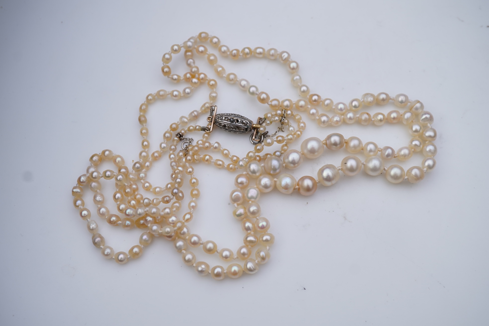 A natural pearl and diamond necklace, early 20th century